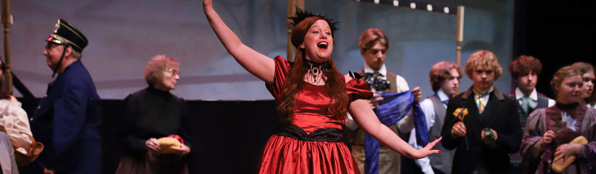 Photo of an opera with a woman singing